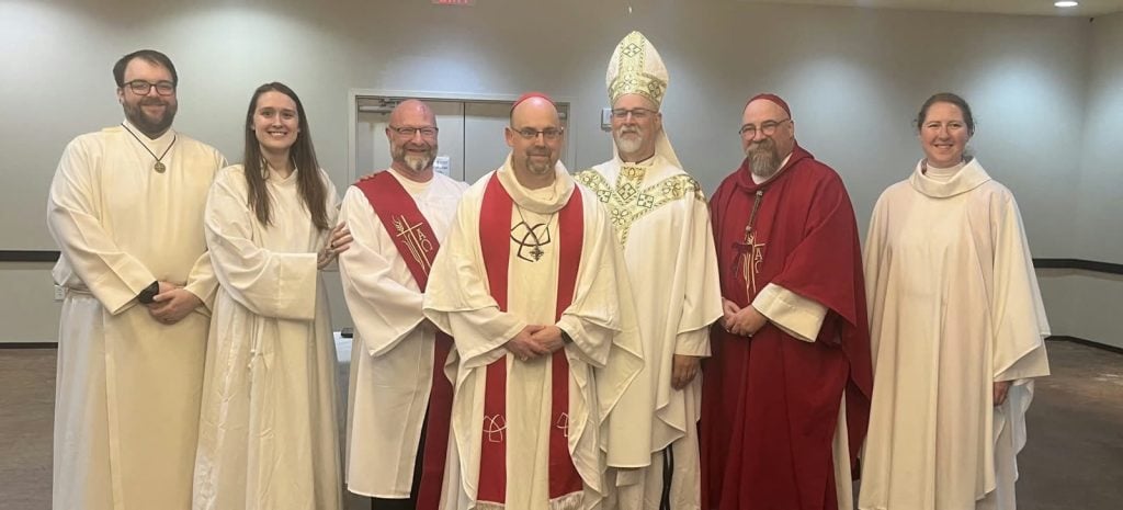 Parish clergy gathered together with a visiting bishop.